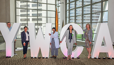 Guests posing with giant letters spelling "Y-W-C-A" at 2019 King County Luncheon