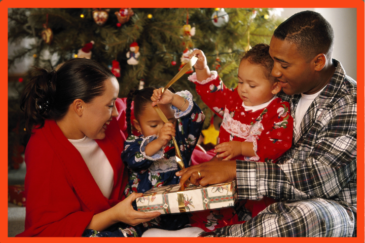 Family opening Christmas gifts together