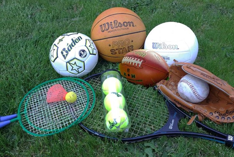A photo of sports items, including rackets, soccer balls, basketballs, volley ball, catcher mitt, and baseball.