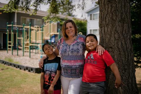 Image of mother and two sons at YWCA's Trinity Place location